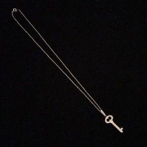 14 K white gold diamond key pendant